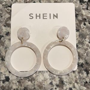 White colored earrings